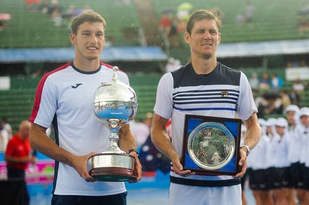 12th January 2018, Kooyong Lawn Tennis Club, Kooyong, Melbourne, Australia; Priceline Pharmacy Kooyong Classic tennis tournament; Pablo Carreno Busta of Spain and Matt Ebden of Australia show off their trophies after the Kooyong Classic final  ActionPlus11970984