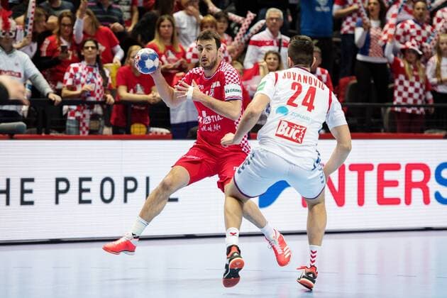 Domagoj Duvnjak 180112 Croatia s and Serbia s Milan Jovanovic in the handball match between Croatia and Serbia in the European Handball CHAMPIONSHIP January 12, 2018 2018 in Split  Copyright: LUDVIGxTHUNMAN BB180112LT110