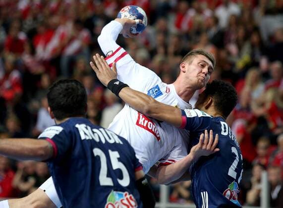 (180115) -- POREC, Jan. 15, 2018 -- Nikola Bilyk (C) of Austria shoots during the second round of EHF Euro 2018 handball match between Austria and France in Porec, Croatia, on Jan. 14, 2018. France won 33-26. ) (SP)CROATIA-POREC-HANDBALL IgorxKralj 