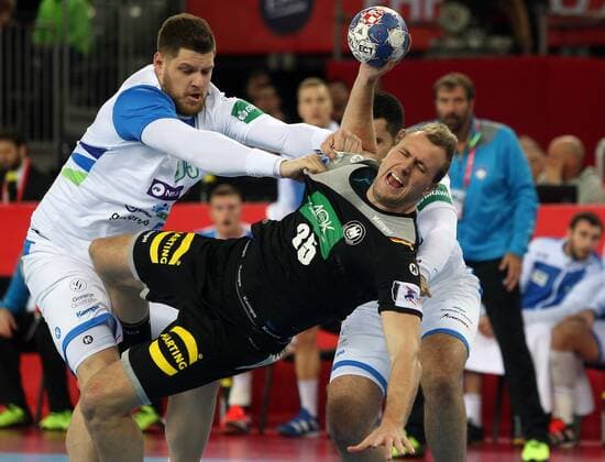 (180116) -- ZAGREB, Jan. 16, 2018 -- Julius Kuhn (R) of Germany competes during the group C match between Slovenia and Germany of 2018 Men s EHF European Handball Championship in Zagreb, Croatia, on Jan. 15, 2018. The match ended with a 25-25 draw. ) (SP)CROATIA-ZAGREB-HANDBALL-EHF EURO 2018-SLO VS GER DaliborxUrukalovic 