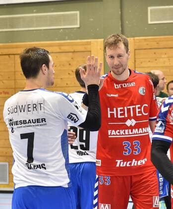 27 01 2018 handball season 2017 2018 test game friendly match HC Erlangen HCE SG BBM Bietigheim OGo Nikolai Link 33 HC Erlangen HCE claps with Dominik Claus 7 from SG BBM Bietigheim