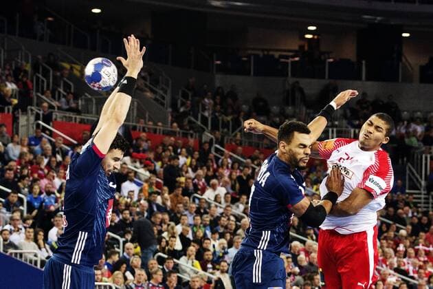 180128 Denmark s Mads Mensah Larsen shoots past France s Nedim Remili and Adrien Dipanda and makes the template during the bronze game between Denmark and France in Handball CHAMPIONSHIP 2018 28 January 2018 in Zagreb  Copyright: FREDRIKxVARFJELL BB180128FV042