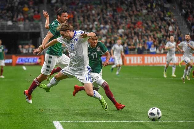 SAN ANTONIO, TX - JANUARY 31: Bosnia and Herzegovina forward Mersudin Ahmetovic (17) is pulled down by Mexico defender Oswaldo Aanis (3) during the soccer match between Mexico and Bosnia & Herzegovina on January 31, 2018 at the Alamodome in San Antonio, Texas. (Photo by Ken Murray Icon Sportswire) SOCCER: JAN 31 Mexico v Bosnia & Herzegovina Icon180131002 EDITORIAL USE ONLY