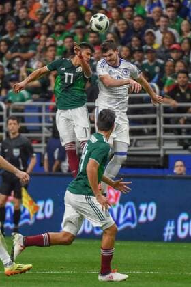 SAN ANTONIO, TX - JANUARY 31: Mexico defender Jesus Gallardo (17) and Bosnia and Herzegovina midfielder Tomislav Tomic (8) fight for a header during second half action during the soccer match between Mexico and Bosnia & Herzegovina on January 31, 2018 at the Alamodome in San Antonio, Texas. (Photo by Ken Murray Icon Sportswire) SOCCER: JAN 31 Mexico v Bosnia & Herzegovina Icon180131030 EDITORIAL USE ONLY