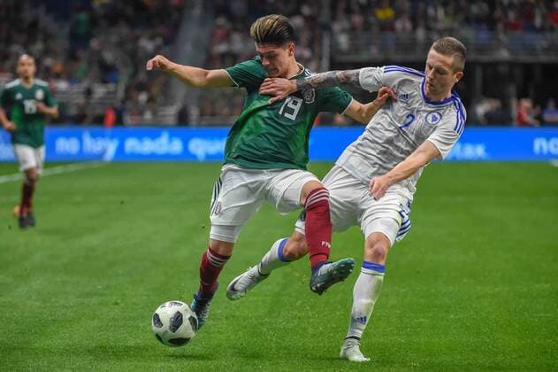 SAN ANTONIO, TX - JANUARY 31: Mexico midfielder Jonathan Gonzalez (19) and Bosnia and Herzegovina defender Almir Bekic (2) fight for a loose ball during second half action during the soccer match between Mexico and Bosnia & Herzegovina on January 31, 2018 at the Alamodome in San Antonio, Texas. (Photo by Ken Murray Icon Sportswire) SOCCER: JAN 31 Mexico v Bosnia & Herzegovina Icon180131032 EDITORIAL USE ONLY