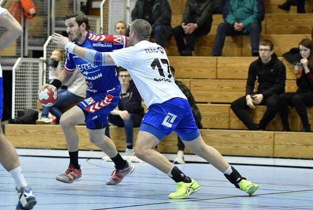 01 02 2018 handball season 2017 2018 test game friendly match HC Erlangen HCE ThSV Eisenach Michael Haaß Haass 13 HC Erlangen HCE Marcel Schliedermann 17 ThSV Eisenach right