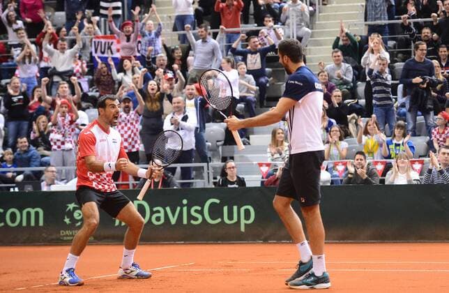 (180204) -- OSIJEK, Feb. 4, 2018 -- Marin Cilic (R) and Ivan Dodig of Croatia celebrate during the third match against Daniel Nestor and Vasek Pospisil of Canada at Davis Cup World Group first round match between Croatia and Canada in Osijek, Croatia, on Feb. 3, 2018. ) (SP)CROATIA-OSIJEK-TENNIS-DAVIS CUP-WORLD GROUP-1ST ROUND-DOUBLES MarkoxPrpic 