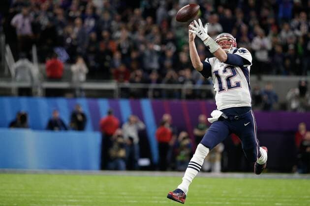 New England Patriots quarterback Tom Brady (12) unable to catch the pass against the Philadelphia Eagles in the second quarter of the Super Bowl LII at U.S. Bank Stadium in Minneapolis, Minnesota on February 4, 2018. The Eagles will be seeking their first title while the Patriots will be after their sixth Super Bowl win.  SBP20180204028 JOHNxANGELILLO
