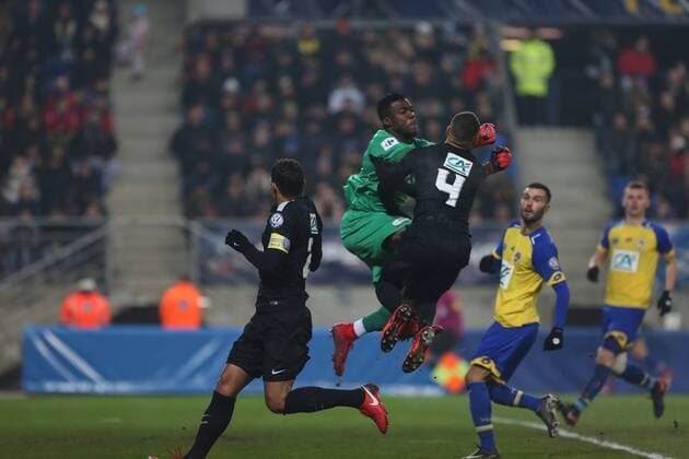 February 6, 2018 - Sochaux, France - Sochaux s Ghanean goalkeeper Lawrence Ati Zigi vies Paris Saint-Germain s French defender Layvin Kurzawa during French League Cup round of sixteen football match between Sochaux (FCSM) and Paris Saint-Germain (PSG), on February 6, 2018 at the Auguste Bonal stadium in Sochaux, France. Sochaux v Paris Saint Germain - French Cup  - ZUMAn230 20180206_zaa_n230_534 Copyright: xElyxandroxCegarrax