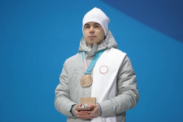 PYEONGCHANG, SOUTH KOREA â€“ FEBRUARY 11, 2018: Short track speed skater Semyon Yelistratov, Olympic Athelet from Russia, poses with his bronze medal at the victory ceremony for the for men s 1500m short track Speed skating Eisschnelllauf event at the 2018 Winter Olympic Games Olympische Spiele Olympia OS at Medals Plaza. Sergei Bobylev TASS  TS0734AD