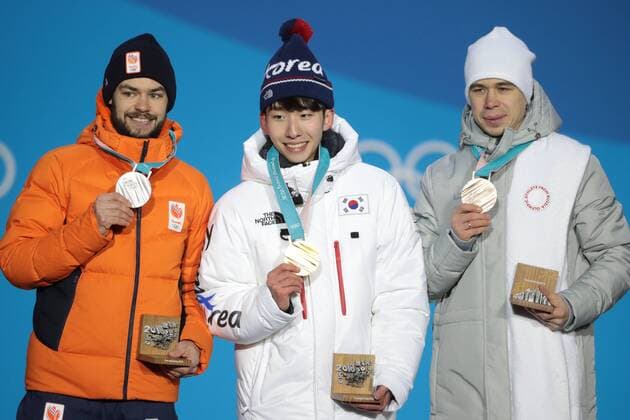 PYEONGCHANG, SOUTH KOREA â€“ FEBRUARY 11, 2018: Silver medallist Sjinkie Knegt of the Netherlands, Gold medallist Lim Hyo-jun of South Korea, and bronze medallist Semyon Yelistratov, Olympic Athlete from Russia, from left, pose at the victory ceremony for the for men s 1500m short track Speed skating Eisschnelllauf event at the 2018 Winter Olympic Games Olympische Spiele Olympia OS at Medals Plaza. Sergei Bobylev TASS  TS0734B1