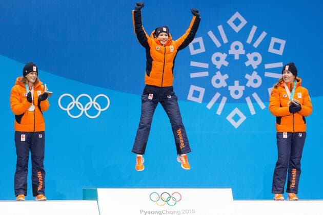 Ladies 3000m Speed skating Eisschnelllauf gold medalist Carlijin Achtereekte (C) of the Netherlands leaps on the podium during a medal ceremony for the Pyeongchang 2018 Winter Olympics, at the Olympic Medal Plaza in Daegwalnyeong, South Korea, on February 11, 2018. Standing to her left is silver medalist Ireen Wust and bronze medalist Antoinette de Jong on her right both of the Netherlands.  OLY20180211122 MATTHEWxHEALEY