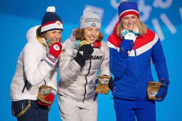 From left womenÕs 7.5m sprint biathlon silver medalist silver medalist Marte Olsbu of Norway, gold medalist Laura Dahlmeier of Germany, and bronze medalist Veronica Vitkova of the Czech Republic pose for a photo on the podium during a medal ceremony for the Pyeongchang 2018 Winter Olympics, at the Olympic Medal Plaza in Daegwalnyeong, South Korea, on February 11, 2018.  OLY20180211139 MATTHEWxHEALEY