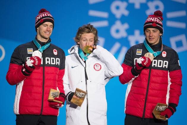 From left menÕs snowboard slopestyle silver medalist Max Parrot of Canada, gold medalist Redmond Gerard of the United States and bronze medalist Mark McMorris of Canada pose for a photo on the podium during a medal ceremony for the Pyeongchang 2018 Winter Olympics, at the Olympic Medal Plaza in Daegwalnyeong, South Korea, on February 11, 2018.  OLY20180211147 MATTHEWxHEALEY