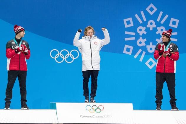 From left menÕs snowboard slopestyle silver medalist Max Parrot of Canada, gold medalist Redmond Gerard of the United States and bronze medalist Mark McMorris of Canada celebrate on the podium during a medal ceremony for the Pyeongchang 2018 Winter Olympics, at the Olympic Medal Plaza in Daegwalnyeong, South Korea, on February 11, 2018.  OLY20180211141 MATTHEWxHEALEY