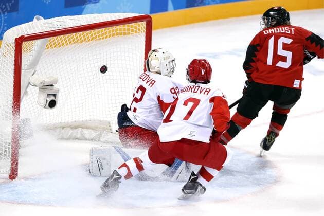 GANGNEUNG, SOUTH KOREA - FEBRUARY 11, 2018: Olympic Athletes from Russia Nadezhda Morozova, Fanuza Kadirova and Canada s Melodie Daoust (L-R) in action in their women s preliminary round Group A Ice hockey Eishockey match at the 2018 Winter Olympic Games Olympische Spiele Olympia OS at Kwandong Hockey Centre. Valery Sharifulin TASS  TS073512