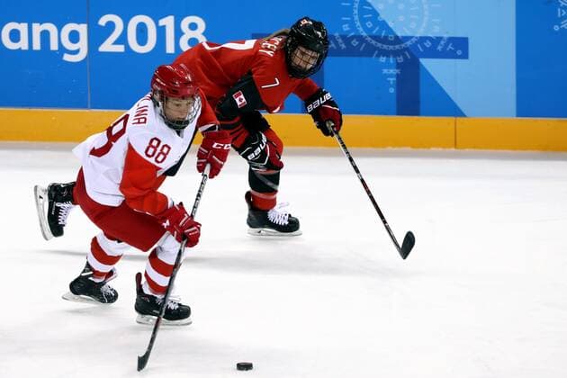 GANGNEUNG, SOUTH KOREA - FEBRUARY 11, 2018: Olympic Athlete from Russia Yekaterina Smolina (L) and Canada s Laura Stacey in action in their women s preliminary round Group A Ice hockey Eishockey match at the 2018 Winter Olympic Games Olympische Spiele Olympia OS at Kwandong Hockey Centre. Valery Sharifulin TASS  TS073513