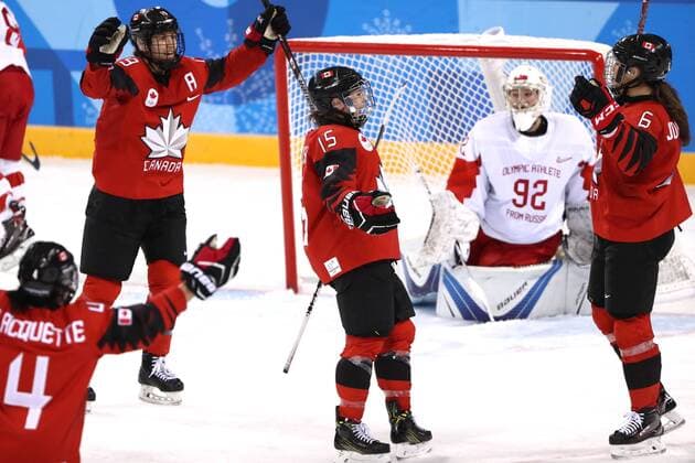 GANGNEUNG, SOUTH KOREA - FEBRUARY 11, 2018: Olympic Athlete from Russia, goalie Nadezhda Morozova (R background) looks on as Canada s players celebrate scoring in their women s preliminary round Group A Ice hockey Eishockey match at the 2018 Winter Olympic Games Olympische Spiele Olympia OS at Kwandong Hockey Centre. Valery Sharifulin TASS  TS07351F