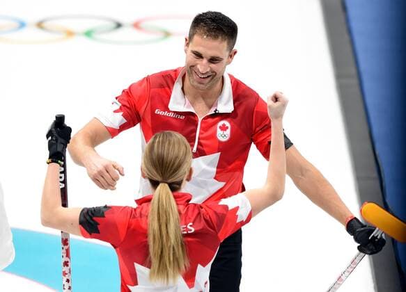 (180212) -- PYEONGCHANG, Feb. 12, 2018 -- Canada s Kaitlyn Lawes (Front) and John Morris celebrate after winning the curling mixed doubles semifinal against Kristin Skaslien and Magnus Nedregotten from Norway at the 2018 PyeongChang Winter Olympic Games Olympische Spiele Olympia OS at the Gangneung Curling Centre in Gangneung, South Korea, on Feb. 12, 2018. Canada won 8-4. ) (SP)OLY-SOUTH KOREA-PYEONGCHANG-CURLING-MIXED DOUBLES-CAN VS NOR MaxPing 