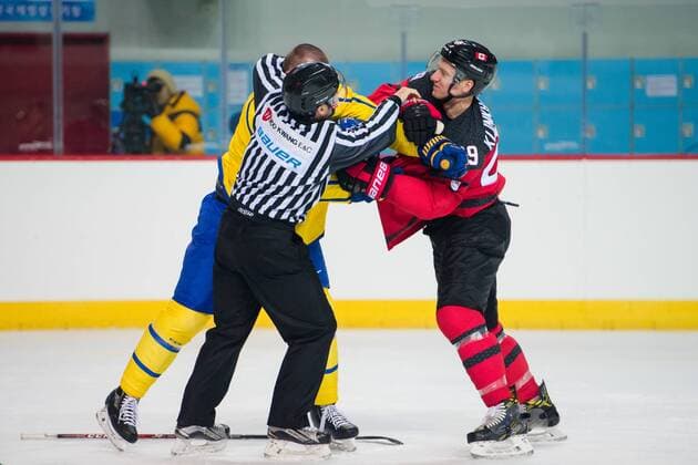 180212 Patrik Hersley of Sweden in a fight with Rob Klinkhammer of Canada during the Men s Ice Hockey International Friendly match between Australia and Canada during day three of the 2018 Winter Olympics on February 12 2018 in Incheon Photo Petter Arvidson BILDBYR N code PA 91961  Copyright: PETTERxARVIDSON BB180212PA057