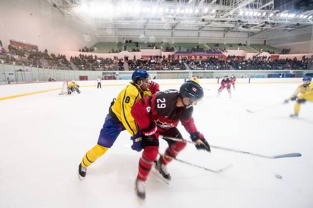 180212 Johan Fransson of Sweden in action with Rob Klinkhammer of Canada during the Men s Ice Hockey International Friendly match between Australia and Canada during day three of the 2018 Winter Olympics on February 12 2018 in Incheon Photo Petter Arvidson BILDBYRAN code PA 91961  Copyright: PETTERxARVIDSON BB180212PA058