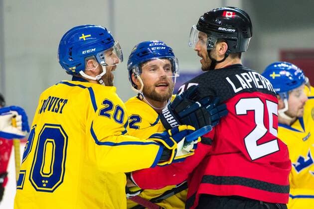 180212 Joel Lundqvist and Fredrik Pettersson of Sweden in a fight with Maxim Lapierre of Canada during the Men s Ice Hockey International Friendly match between Australia and Canada during day three of the 2018 Winter Olympics on February 12 2018 in Incheon Photo Petter A.j BILDBYR N code PA 91961  Copyright: PETTERxARVIDSON BB180212PA072