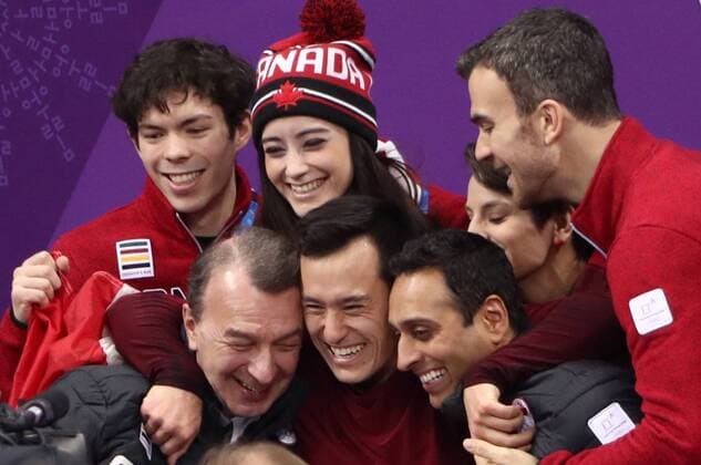 GANGNEUNG, SOUTH KOREA â€“ FEBRUARY 12, 2018: Figure skater Patrick Chan of Canada with his coaches Oleg Epstein (L) waits for the score after performing the men s free skating event as part of the Figure skating Eiskunstlauf team event at the 2018 Winter Olympic Games Olympische Spiele Olympia OS at the Gangneung Ice Arena. Pictured back are Eric Radford, Meagan Duhamel, and Kaetlyn Osmond. Valery Sharifulin TASS  TS0736A5