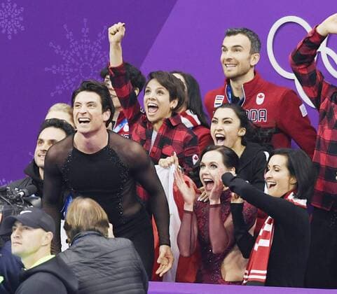 Pyeongchang Olympics Canadian ice dance pair Tessa Virtue (front, 2nd from R) and Scott Moir (front, 3rd from R) celebrate with teammates after their country won the Figure skating Eiskunstlauf team event in Gangneung, South Korea, at the Pyeongchang Winter Olympics on Feb. 12, 2018. 
