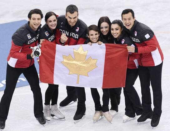 Pyeongchang Olympics The Canadian team poses with the national flag after winning the Figure skating Eiskunstlauf team event in Gangneung, South Korea, at the Pyeongchang Winter Olympics on Feb. 12, 2018. 