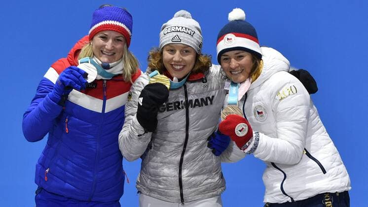 L-R Norwegian biathlete Marte Olsbu (silver medal), German biathlete Laura Dahlmeier (gold medal) and Czech biathlete Veronika Vitkova (bronze medal) are seen during the medal ceremony of biathlon, 7,5 KM, women, within the 2018 Winter Olympics in Pyeongchang, South Korea, February 11, 2018. (CTKxPhoto MichalxKamaryt) CTKPhotoP201802110415601  kmt 9