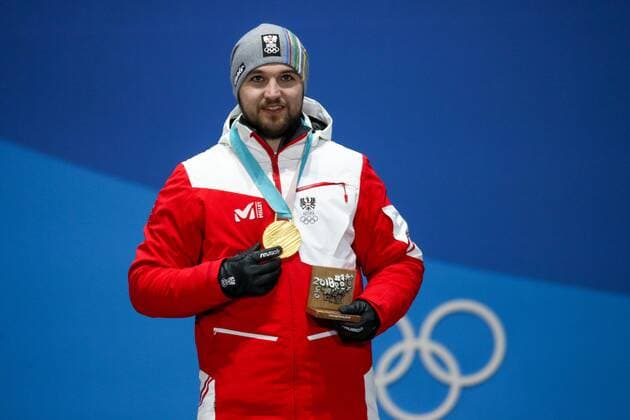 OLYMPICS - 2018 Winter Olympics PYEONGCHANG,SOUTH KOREA,12.FEB.18 - OLYMPICS, LUGE - Olympic Winter games Winterspiele Spiele Summer games PyeongChang 2018, Medals Plaza, men, award ceremony. Image shows David Gleirscher (AUT). Keywords: medal. GEPAxpictures xMaticxKlansek