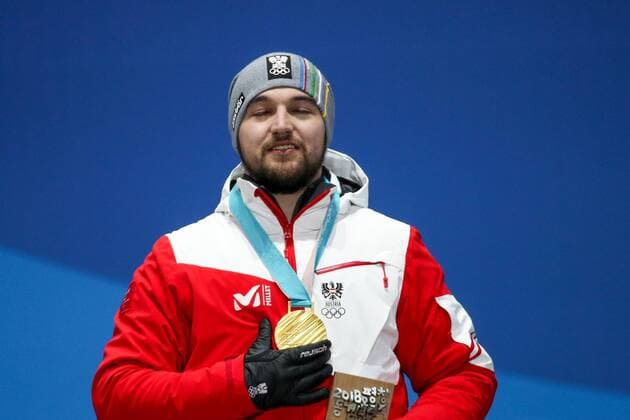 OLYMPICS - 2018 Winter Olympics PYEONGCHANG,SOUTH KOREA,12.FEB.18 - OLYMPICS, LUGE - Olympic Winter games Winterspiele Spiele Summer games PyeongChang 2018, Medals Plaza, men, award ceremony. Image shows David Gleirscher (AUT). Keywords: medal. GEPAxpictures xMaticxKlansek