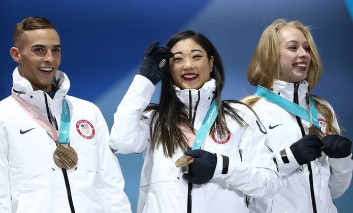 PYEONGCHANG, SOUTH KOREA â€“ FEBRUARY 12, 2018: Figure skaters Adam Rippon, Mirai Nagasu, and Bradie Tennell (L-R) of the United States pose with their bronze medals during the victory ceremony for the Figure skating Eiskunstlauf team event at the 2018 Winter Olympic Games Olympische Spiele Olympia OS Valery Sharifulin TASS  TS073778
