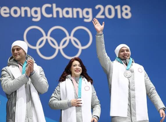 PYEONGCHANG, SOUTH KOREA â€“ FEBRUARY 12, 2018: Olympic Athletes from Russia Alexander Enbert, Ekaterina Bobrova, and Dmitri Soloviev, from left, pose with their silver medals during the victory ceremony for the Figure skating Eiskunstlauf team event at the 2018 Winter Olympic Games Olympische Spiele Olympia OS Valery Sharifulin TASS  TS073781