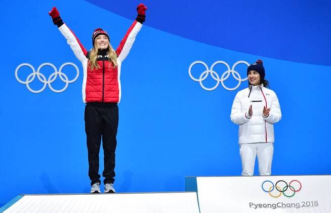 Canada s Justine Dufour-Lapointe (L) celebrates alongside gold medalist France s Perrine Laffont during the medal ceremony for Ladies Moguls during the Pyeongchang 2018 Winter Olympics in Pyeongchang, South Korea, on February 12, 2018.  OLY20180212352 KEVINxDIETSCH