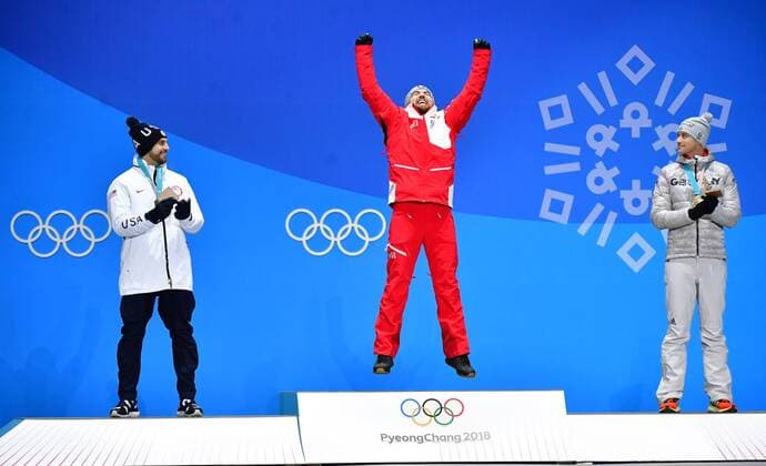 Gold medalist Austria s David Gleirscher (C), celebrates alongside Silver medalist American Chris Mazdzer (L) and bronze medalist Germany s Johannes Ludwig during the medal ceremony for Men s Luge during the Pyeongchang 2018 Winter Olympics in Pyeongchang, South Korea, on February 12, 2018.  OLY20180212362 KEVINxDIETSCH