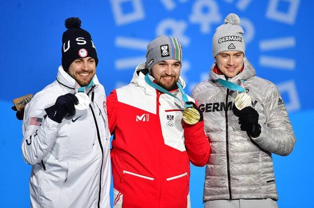 Silver medalist American Chris Mazdzer (L), gold medalist Austria s David Gleirscher and bronze medalist Germany s Johannes Ludwig pose together during the medal ceremony for Men s Luge during the Pyeongchang 2018 Winter Olympics in Pyeongchang, South Korea, on February 12, 2018.  OLY20180212359 KEVINxDIETSCH