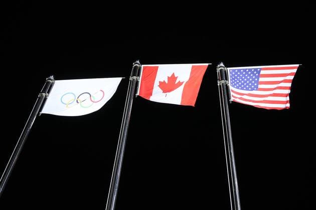 OLYMPICS - 2018 Winter Olympics PYEONGCHANG,SOUTH KOREA,12.FEB.18 - OLYMPICS, Figure skating Eiskunstlauf - Olympic Winter games Winterspiele Spiele Summer games PyeongChang 2018, Medals Plaza, team event, award ceremony. Image shows the flags. GEPAxpictures xMaticxKlansek