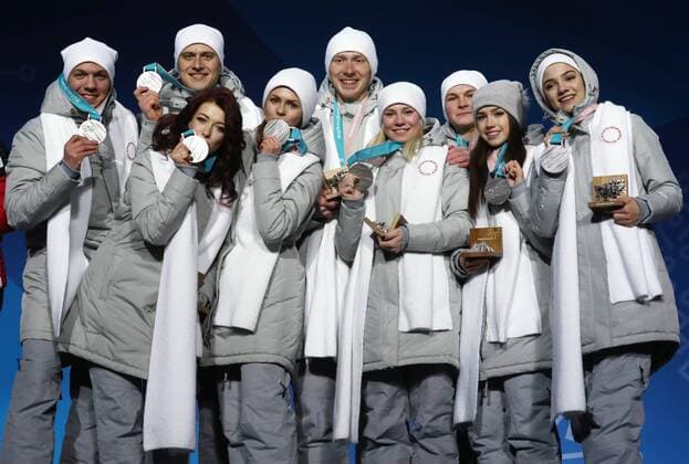 PYEONGCHANG, SOUTH KOREA â€“ FEBRUARY 12, 2018: Olympic Athletes from Russia Dmitri Soloviev, Alexander Enbert, Ekaterina Bobrova, Natalya Zabiyako, Vladimri Morozov, Yevgenia Tarasova, Mikhail Kolyada, Alina Zagitova, and Evgenia Medvedeva, from left, pose with their silver medals during the victory ceremony for the Figure skating Eiskunstlauf team event at the 2018 Winter Olympic Games Olympische Spiele Olympia OS Valery Sharifulin TASS  TS0737C1