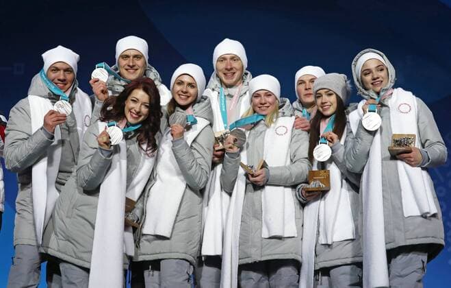 PYEONGCHANG, SOUTH KOREA â€“ FEBRUARY 12, 2018: Olympic Athletes from Russia Dmitri Soloviev, Alexander Enbert, Ekaterina Bobrova, Natalya Zabiyako, Vladimir Morozov, Yevgenia Tarasova, Mikhail Kolyada, Alina Zagitova, and Evgenia Medvedeva, from left, pose with their silver medals during the victory ceremony for the Figure skating Eiskunstlauf team event at the 2018 Winter Olympic Games Olympische Spiele Olympia OS Valery Sharifulin TASS  TS0737C2
