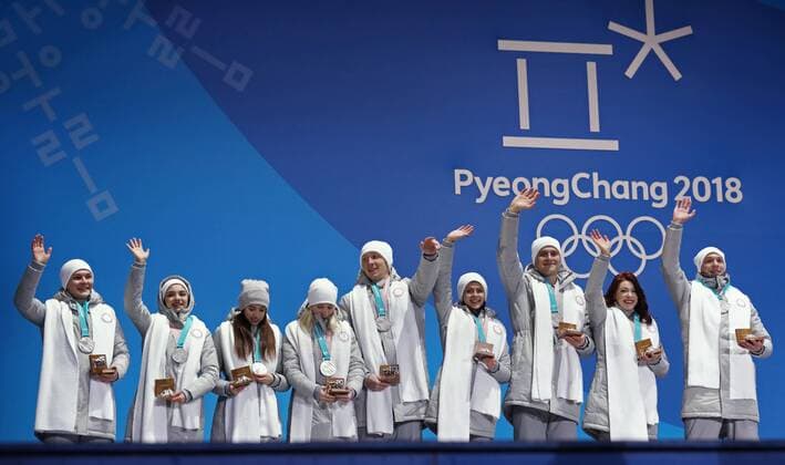 PYEONGCHANG, SOUTH KOREA â€“ FEBRUARY 12, 2018: Olympic Athletes from Russia Mikhail Kolyada, Evgenia Medvedeva, Alina Zagitova, Yevgenia Tarasova, Vladimir Morozov, Natalya Zabiyako, Alexander Enbert, Ekaterina Bobrova, and Dmitri Soloviev (L-R) pose with their silver medals during the victory ceremony for the Figure skating Eiskunstlauf team event at the 2018 Winter Olympic Games Olympische Spiele Olympia OS Valery Sharifulin TASS  TS0737CA