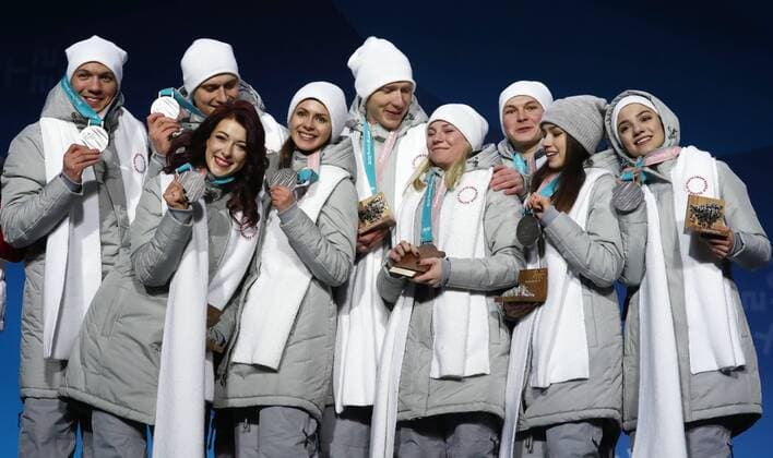 PYEONGCHANG, SOUTH KOREA â€“ FEBRUARY 12, 2018: Olympic Athletes from Russia Dmitri Soloviev, Alexander Enbert, Ekaterina Bobrova, Natalya Zabiyako, Vladimir Morozov, Yevgenia Tarasova, Mikhail Kolyada, Alina Zagitova, and Evgenia Medvedeva, from left, pose with their silver medals during the victory ceremony for the Figure skating Eiskunstlauf team event at the 2018 Winter Olympic Games Olympische Spiele Olympia OS Valery Sharifulin TASS  TS0737CC