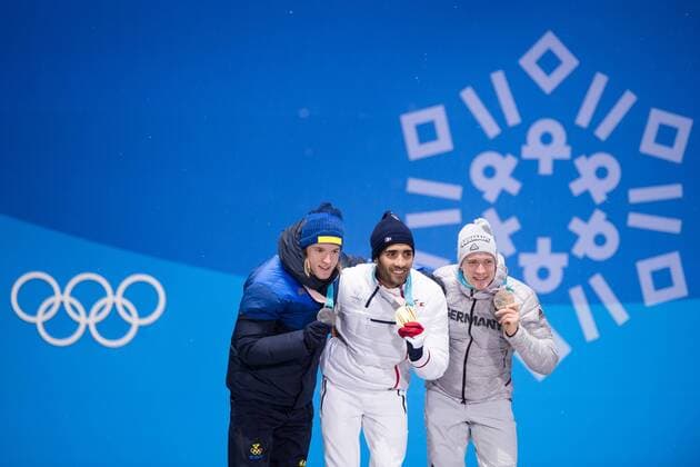 180213 Sebastian Samuelsson of Sweden silver Martin Fourcade of France Gold and Benedikt Doll of Germany Bronze celebrates at the medal ceremony for the Men s Biathlon 12 5 km Pursuit during day four of the 2018 Winter Olympics on February 13 2018 in Pyeongchang Photo Jon Olav Nesvold BILDBYRAN code JE 160160  Copyright: JONxOLAVxNESVOLD BB180213JE087