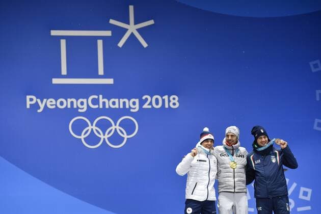 Men s 10-kilometer biathlon sprint medalists from left, the Czech Republic s Michal Krcmar, silver, Germany s Arnd Peiffer, gold, and Italy s Dominik Windisch, bronze, pose during their medals ceremony at the 2018 Winter Olympics in Pyeongchang, South Korea, February 13, 2018. (CTKxPhoto MichalxKamaryt) CTKPhotoP201802130605401  kmt 13