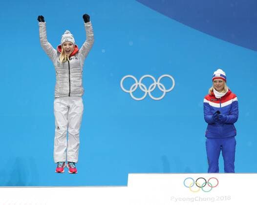 (180213) -- PYEONGCHANG, Feb. 13, 2018 -- Champion Maren Lundby (R) from Norway and second-placed Katharina Althaus from Germany celebrate during the medal ceremony of ladies normal hill individual event of Ski jumping Skispringen Ski nordisch at 2018 PyeongChang Winter Olympic Games Olympische Spiele Olympia OS at the Medal Plaza in PyeongChang, South Korea, on Feb. 13, 2018. ) (SP)OLY-SOUTH KOREA-PYEONGCHANG-SKI JUMPING-LADIES NORMAL HILL INDIVIDUAL-MEDAL CEREMONY BaixXuefei 