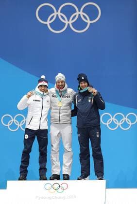 (180213) -- PYEONGCHANG, Feb. 13, 2018 -- Champion Arnd Peiffer from Germany (C), second-placed Michal Krcmar from Czech Republic (L) and third-placed Dominik Windisch from Italy pose for photos during the medal ceremony of men s 10km sprint event of biathlon at 2018 PyeongChang Winter Olympic Games Olympische Spiele Olympia OS at the Medal Plaza in PyeongChang, South Korea, on Feb. 13, 2018. ) (SP)OLY-SOUTH KOREA-PYEONGCHANG-BIATHLON-MEN S 10KM SPRINT-MEDAL CEREMONY BaixXuefei 