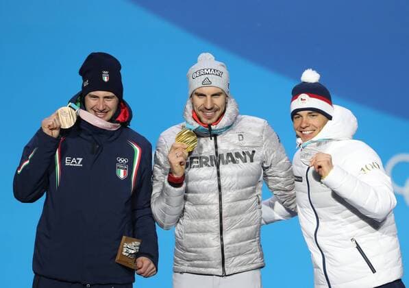 (180213) -- PYEONGCHANG, Feb. 13, 2018 -- Champion Arnd Peiffer from Germany (C), second-placed Michal Krcmar from Czech Republic (R) and third-placed Dominik Windisch from Italy pose for photos during the medal ceremony of men s 10km sprint event of biathlon at 2018 PyeongChang Winter Olympic Games Olympische Spiele Olympia OS at the Medal Plaza in PyeongChang, South Korea, on Feb. 13, 2018. ) (SP)OLY-SOUTH KOREA-PYEONGCHANG-BIATHLON-MEN S 10KM SPRINT-MEDAL CEREMONY BaixXuefei 