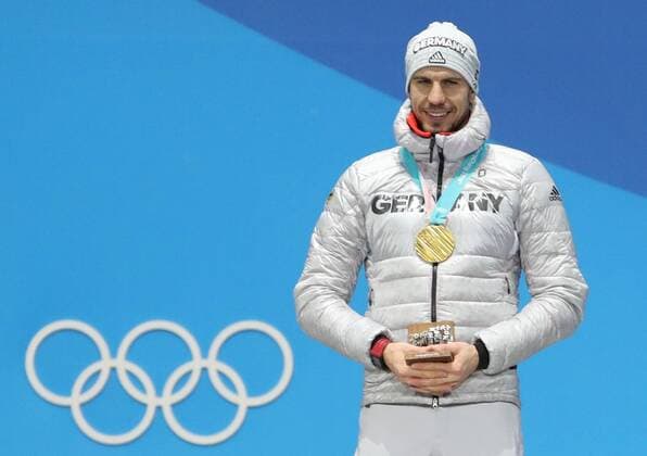 (180213) -- PYEONGCHANG, Feb. 13, 2018 -- Champion Arnd Peiffer from Germany poses for photos during the medal ceremony of men s 10km sprint event of biathlon at 2018 PyeongChang Winter Olympic Games Olympische Spiele Olympia OS at the Medal Plaza in PyeongChang, South Korea, on Feb. 13, 2018. ) (SP)OLY-SOUTH KOREA-PYEONGCHANG-BIATHLON-MEN S 10KM SPRINT-MEDAL CEREMONY BaixXuefei 