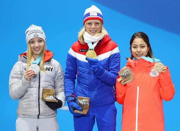 Pyeongchang Olympics Gold medalist Maren Lundby (C) of Norway, silver medalist Katharina Althaus (L) of Germany and bronze medalist Sara Takanashi of Japan attend the medal ceremony for the women s normal hill individual Ski jumping Skispringen Ski nordisch at the Pyeongchang Winter Olympics in South Korea on Feb. 13, 2018. 