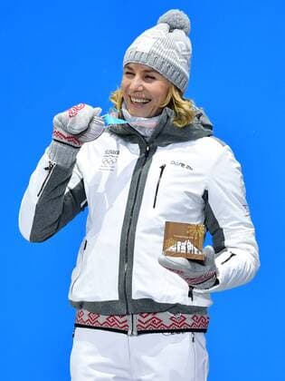 Silver medalist Slovakia s Anastasiya Kuzmina, celebrates during the medal ceremony for Biathlon Women s 10km Pursuit at the medal s plaza during the Pyeongchang 2018 Winter Olympics in Pyeongchang, South Korea, on February 13, 2018.  OLY20180213376 KEVINxDIETSCH
